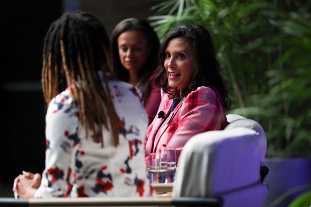 Governor Gretchen Whitmer speaks with Angela Ferrell-Zabala, Moms Demand Action executive director, and Alexis McGill Johnson, Panned Parenthood Action Fund president, during a discussion about reproductive rights and gun safety on the ballot at the Revel Motor Row on Aug. 20, 2024. (Eileen T. Meslar/Chicago Tribune)