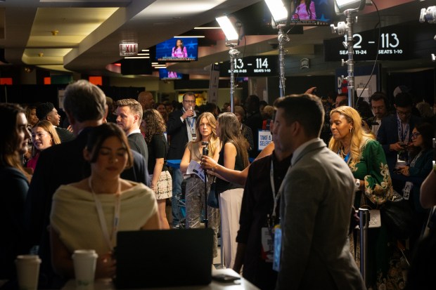 Content creators work the blue carpet area at the Democratic National Convention on Aug. 21, 2024. (E. Jason Wambsgans/Chicago Tribune)