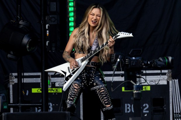 Kiki Wong of The Smashing Pumpkins performs at Wrigley Field in Chicago on Aug. 13, 2024. (Tess Crowley/Chicago Tribune)