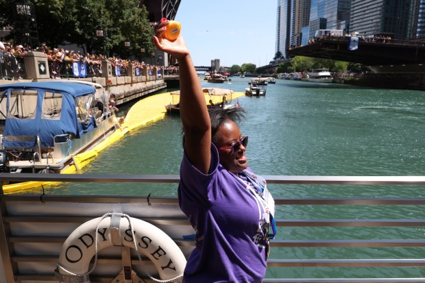 Ashley Jones, 2024 Chicago Duck Derby ambassador, holds the winning duck in Aug. 7, 2024. (Terrence Antonio James/Chicago Tribune)