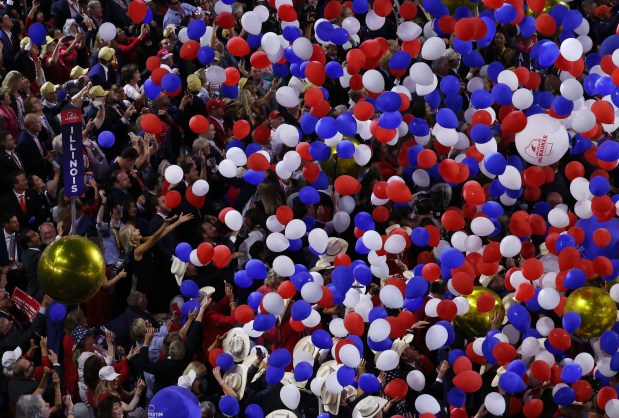 Balloons fall onto Illinois delegates after presidential candidate Donald Trump's speech during the Republican National Convention session at Fiserv Forum on July 18, 2024, in Milwaukee. (John J. Kim/Chicago Tribune)