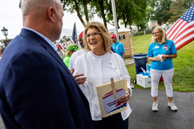 Illinois Republican Party Chair Kathy Savi speaks to former U.S Attorney General Matt Whitaker during Republican Day at the Illinois State Fair in Springfield on Aug. 15, 2024. (Tess Crowley/Chicago Tribune)