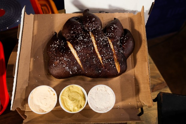 Bear Claw Pretzel, a new concession item, is displayed during a tasting event and hospitality exhibition at Soldier Field on Wednesday, Aug. 28, 2024. (Eileen T. Meslar/Chicago Tribune)