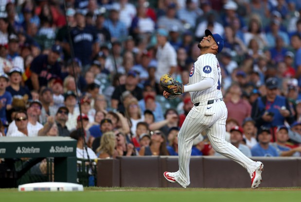 Chicago Cubs third baseman Isaac Paredes (17) tracks a foul pop up before making a catch for an out in the second inning of a game against the St. Louis Cardinals at Wrigley Field in Chicago on Aug. 1, 2024. (Chris Sweda/Chicago Tribune)