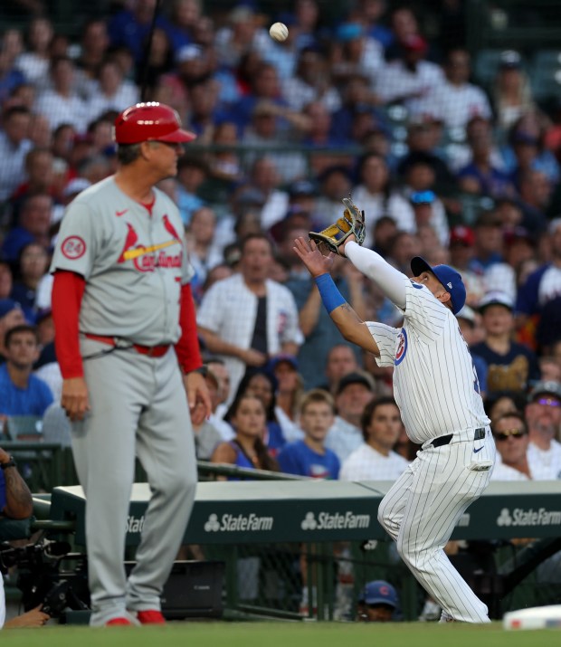 Chicago Cubs third baseman Isaac Paredes (17) makes a catch of a foul pop in the second inning of a game against the St. Louis Cardinals at Wrigley Field in Chicago on Aug. 1, 2024. (Chris Sweda/Chicago Tribune)