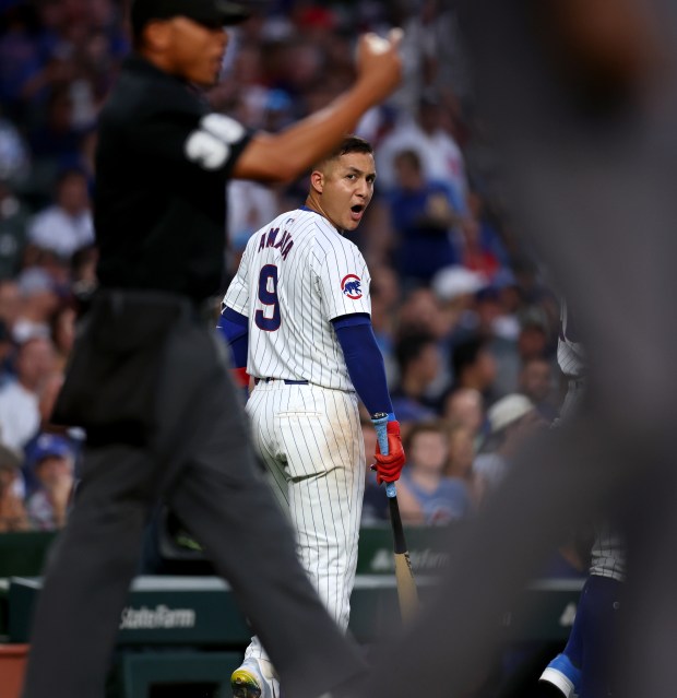 Chicago Cubs catcher Miguel Amaya (9) argues with home plate umpire Jeremie Rehak after striking out on an automatic strike three in the second inning of a game against the St. Louis Cardinals at Wrigley Field in Chicago on Aug. 1, 2024. (Chris Sweda/Chicago Tribune)