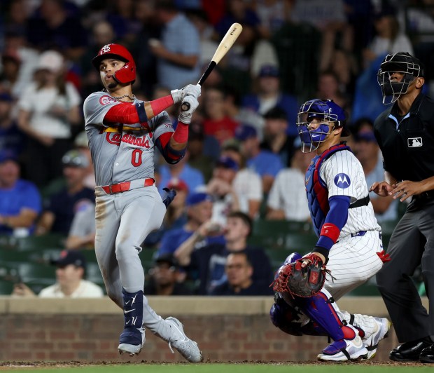 St. Louis Cardinals shortstop Masyn Winn hits a 2-run home run in the seventh inning of a game against the Chicago Cubs at Wrigley Field in Chicago on Aug. 1, 2024. (Chris Sweda/Chicago Tribune)