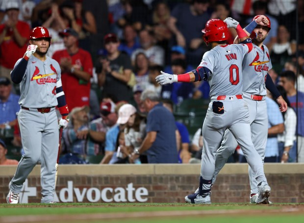 St. Louis Cardinals shortstop Masyn Winn is congratulated by teammate Michael Siani (right) after Winn hit a 2-run home run in the seventh inning of a game against the Chicago Cubs at Wrigley Field in Chicago on Aug. 1, 2024. (Chris Sweda/Chicago Tribune)