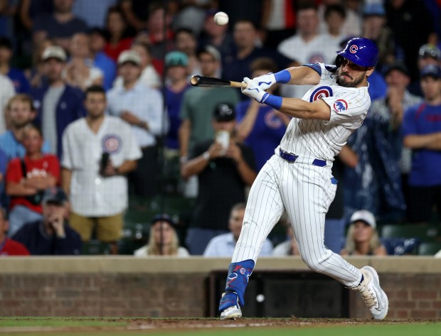 Chicago Cubs hitter Mike Tauchman drives in the game-winning run on a walk-off double in the ninth inning of a game against the St. Louis Cardinals at Wrigley Field in Chicago on Aug. 1, 2024. (Chris Sweda/Chicago Tribune)