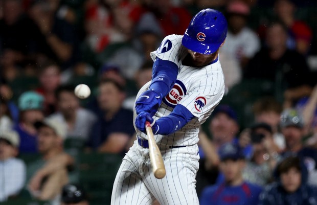 Chicago Cubs designated hitter Cody Bellinger (24) hits a solo home run in the ninth inning of a game against the St. Louis Cardinals at Wrigley Field in Chicago on Aug. 1, 2024. (Chris Sweda/Chicago Tribune)