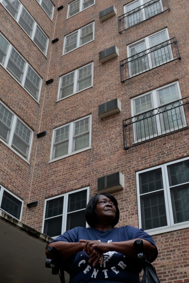 Dearborn Homes resident Brenda Moore outside her apartment building a CHA public housing development in Chicago, Aug. 15, 2024. (Antonio Perez/Chicago Tribune)