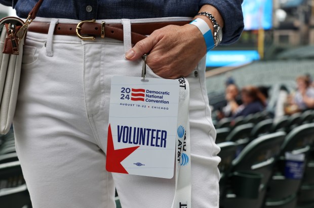 Barbara Halverson holds her volunteer credential during the Democratic National Convention's Volunteer Appreciation Rally at Wrigley Field, Aug. 15, 2024. (John J. Kim/Chicago Tribune)