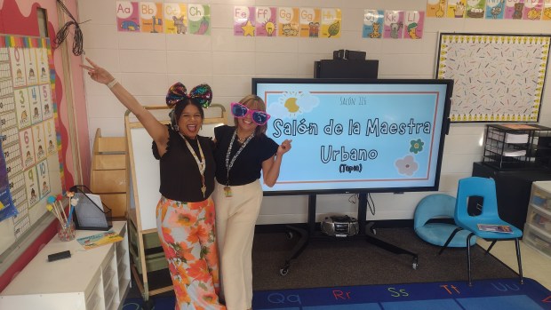 Dual language kindergarten teachers Zahidelys Urbano and her mother, Zahidee Marcano celebrate the first day of school at Ronald D. O'Neal Elementary School in Elgin Tuesday, Aug. 13. (Mike Danahey/Elgin Courier-News)