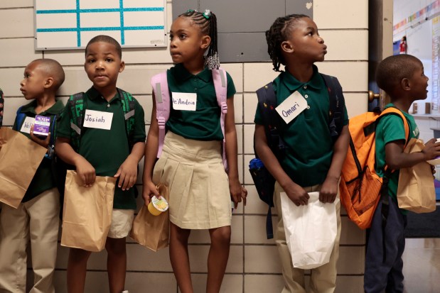 First graders line up on their first day back to school at Chalmers Elementary Specialty School on Monday, Aug. 26, 2024. (Antonio Perez/Chicago Tribune)