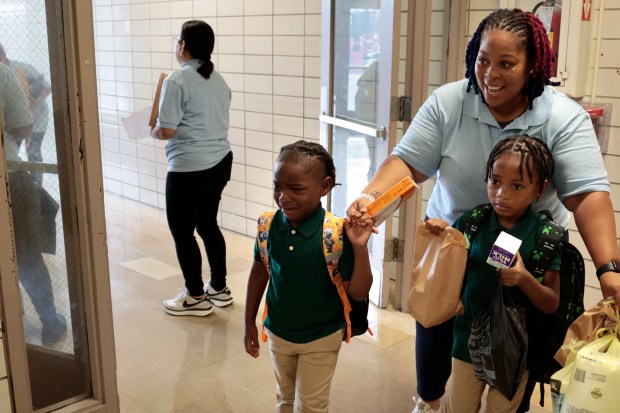 A few tears on arriving students on their first day back to school at Chalmers Elementary Specialty School in Chicago, Monday, Aug. 26, 2024. (Antonio Perez/Chicago Tribune)