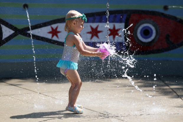 Caroline McIntyre, 2, plays at Margaret Donahue Park in Lake View on Monday, Aug. 26, 2024. (Eileen T. Meslar/Chicago Tribune)