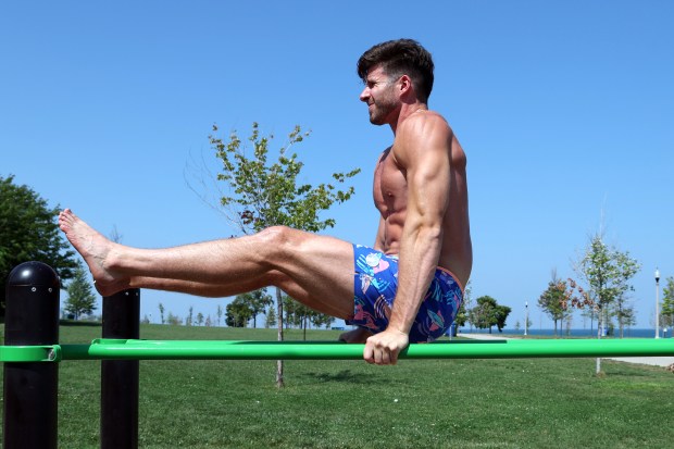 Aidan Pazan, of Chicago, exercises at Burnham Park in Chicago with the region under an excessive heat warning on Monday, Aug. 26, 2024. (Terrence Antonio James/Chicago Tribune)