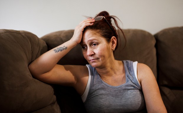 Esperanza Mendez sits on the couch in her home in Chicago's Englewood neighborhood on July 9, 2024. (Armando L. Sanchez/Chicago Tribune)