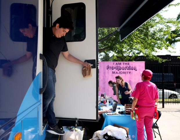 Marcus Aguinaga exits the Planned Parenthood Mobile Health Clinic after getting a vasectomy on Aug. 19, 2024, in Chicago. His procedure was free. The mobile health clinic was set up less than a mile from the Democratic National Convention at the United Center where reproductive rights are an important topic in this year's election. (Stacey Wescott/Chicago Tribune)