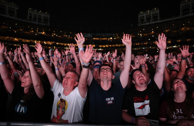 Fans react to the music of Pearl Jam during their performance at Wrigley Field on Aug. 29, 2024. (Chris Sweda/Chicago Tribune)