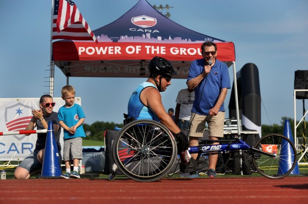 Dave Kappas works as the official announcer for the PUMA's Chi-Town Miles event presented by Chicago Area Runners Association at the Wilson Ave. track near Montrose Beach in Chicago on July 27, 2024. (Chris Sweda/Chicago Tribune)