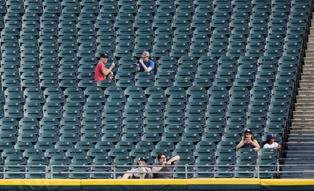 A small group of fans are seen in the right field bleachers in the fifth inning of a game between the Chicago White Sox and the Texas Rangers at Guaranteed Rate Field in Chicago on Aug. 28, 2024. (Chris Sweda/Chicago Tribune)