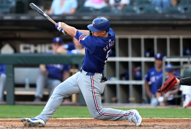 Texas Rangers shortstop Corey Seager (5) drives in a run on a single in the seventh inning of a game against the Chicago White Sox at Guaranteed Rate Field in Chicago on Aug. 28, 2024. (Chris Sweda/Chicago Tribune)