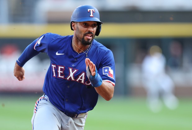 Texas Rangers second baseman Marcus Semien (2) advances to third base in the seventh inning of a game against the Chicago White Sox at Guaranteed Rate Field in Chicago on Aug. 28, 2024. (Chris Sweda/Chicago Tribune)