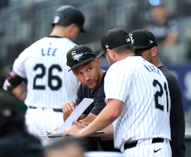 Chicago White Sox interim manager Grady Sizemore talks to his coaching staff in the sixth inning of a game against the Texas Rangers at Guaranteed Rate Field in Chicago on Aug. 28, 2024. (Chris Sweda/Chicago Tribune)