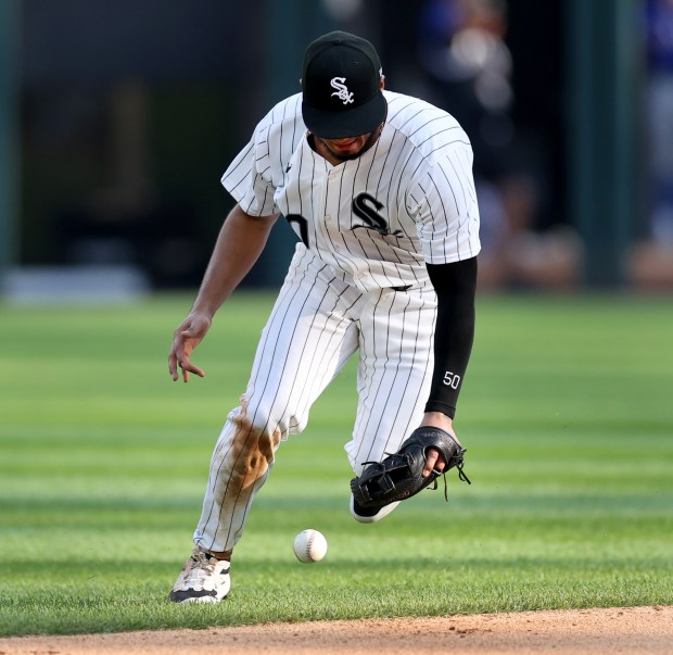 Chicago White Sox second baseman Lenyn Sosa (50) is unable to successfully field a ground ball in the sixth inning of a game against the Texas Rangers at Guaranteed Rate Field in Chicago on Aug. 28, 2024. (Chris Sweda/Chicago Tribune)