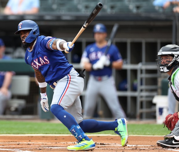 Texas Rangers outfielder Adolis García (53) drives in a run on a double in the first inning of a game against the Chicago White Sox at Guaranteed Rate Field in Chicago on Aug. 28, 2024. (Chris Sweda/Chicago Tribune)