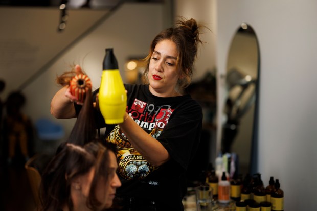 Yolanda Trejo, 38, works on a client at her salon in the West Town neighborhood on Aug. 1, 2024, in Chicago. Trejo's dad is a second-generation Mexican-American and her mom is white. (Armando L. Sanchez/Chicago Tribune)