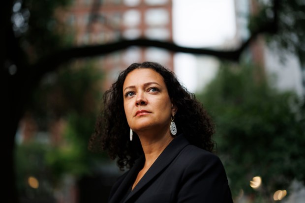 Alayna Washington Crenshaw, 49, poses for a portrait in Connors Park on Aug. 2, 2024, in Chicago. Crenshaw's father is African American and her mother is white. (Armando L. Sanchez/Chicago Tribune)