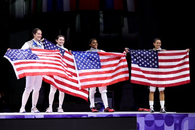 (L-R) Jacqueline Dubrovich, Maia Weintraub, Lauren Scruggs and Lee Kiefer Team United States celebrate winning against Team Italy during the Fencing Women's Foil Team Gold Medal match between Team Italy and Team United States on day six of the Olympic Games Paris 2024 at Grand Palais on Aug. 01, 2024 in Paris, France. (Photo by Clive Brunskill/Getty Images)