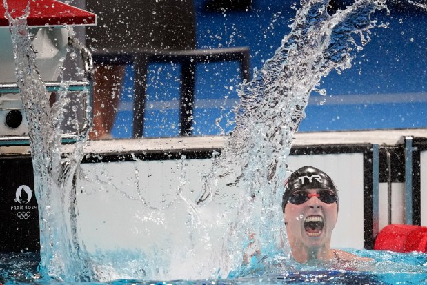 Katie Ledecky, of the United States, celebrates after winning the women's 1500-meter freestyle final at the 2024 Summer Olympics, Wednesday, July 31, 2024, in Nanterre, France. (AP Photo/Petr David Josek)