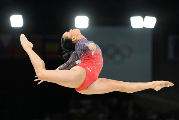 Suni Lee performs on the balance beam during the women's artistic gymnastics all-around finals. (AP Photo/Abbie Parr)