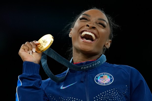 Simone Biles celebrates after winning the gold medal in vault at Bercy Arena on Aug. 3, 2024, in Paris. (AP Photo/Francisco Seco)