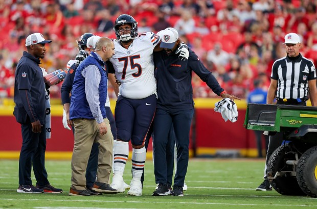 Bears offensive lineman Larry Borom is helped to a cart during the first quarter of a preseason game against the Chiefs on Aug. 22, 2024, in Kansas City, Mo. (David Eulitt/Getty)