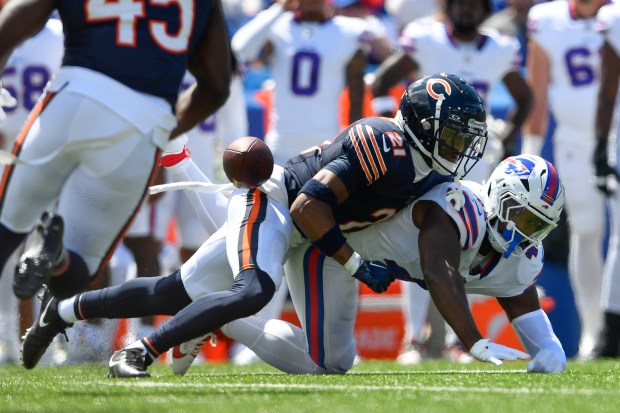 Chicago Bears defensive back Jaylon Jones, top, breaks up a pass intended for Buffalo Bills fullback Reggie Gilliam during the first half of a preseason NFL football game in Orchard Park, N.Y., Saturday, Aug. 10, 2024. (AP Photo/Adrian Kraus)