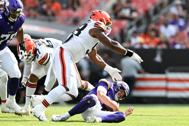 Browns defensive tackle Chris Williams sacks Vikings quarterback Nick Mullens during a preseason game on Aug. 17, 2024, in Cleveland. (Nick Cammett/Getty)