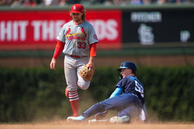 Cubs center fielder Pete Crow-Armstrong steals second base next to Cardinals second baseman Brendan Donovan during the seventh inning on Aug. 2, 2024, at Wrigley Field. (Erin Hooley/AP)