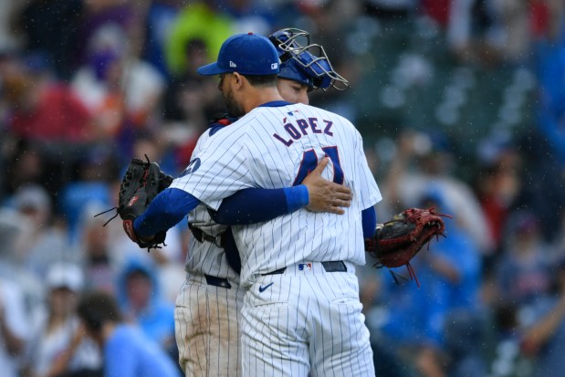 Reliever Jorge López (41) celebrates with catcher Miguel Amaya after the Cubs defeated the Blue Jays 3-2 on Aug. 17, 2024, at Wrigley Field. (Paul Beaty/AP)