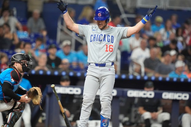 Chicago Cubs' Patrick Wisdom (16) reacts after bring called out on strikes during the fourth inning of a baseball game against the Miami Marlins, Sunday, Aug. 25, 2024, in Miami. (AP Photo/Lynne Sladky)