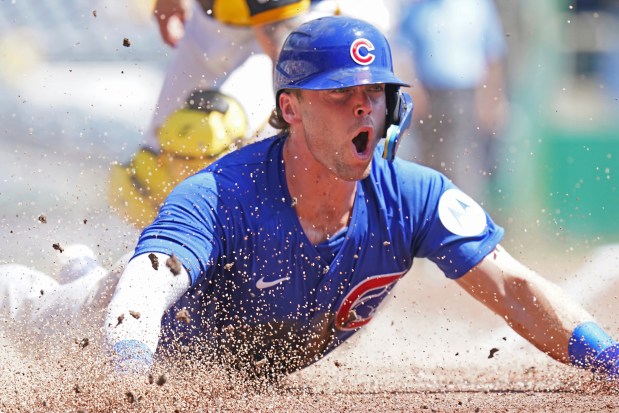 Chicago Cubs' Nico Hoerner scores during the second inning of a baseball game against the Pittsburgh Pirates Wednesday, Aug. 28, 2024, in Pittsburgh. (AP Photo/Matt Freed)