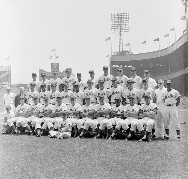 Team members of the New York Mets National League baseball team pose at the Polo Grounds in New York City, June 20, 1962. Seated in the front row, from left, are, Frank Prudenti, assistant equipment manager; Rod Kanehl; Frank Thomas; Joe Christopher; Cookie Lavagetto, coach; Casey Stengel, manager; Solly Hemus, coach; Red Ruffing, coach; Red Kress, coach; Gene Woodling; and Gil Hodges. In foreground is batboy Harvey Kannitzer. Standing in middle row, from left, are, Gus Mauch, trainer; Lou Niss, traveling secretary; Cliff Cook; Felix Mantilla; Chris Cannizzaro; Richie Ashburn; Al Jackson; Craig Anderson; Ray Daviault; Jim Hickman; Bob Moorhead; Bob Miller; Lynn Lischer, assistant trainer; and Elio Chacon. Standing in third row, from left, are, Marv Throneberry; Sam Taylor; Bill Hunter; Roger Craig; Charlie Neal; Dave Hillman; Vinegar Bend Mizell; Jay Hook; Ken MacKenzie; and Herb Norman, equipment manager. (AP Photo)