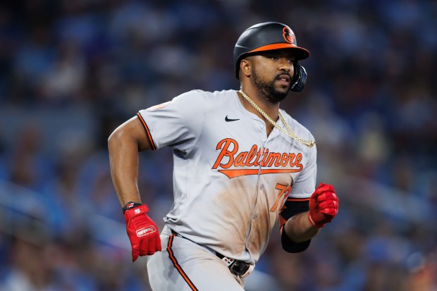 Orioles slugger Eloy Jiménez runs out a two-run double against the Blue Jays on Aug. 7, 2024 in Toronto. (Cole Burston/Getty)