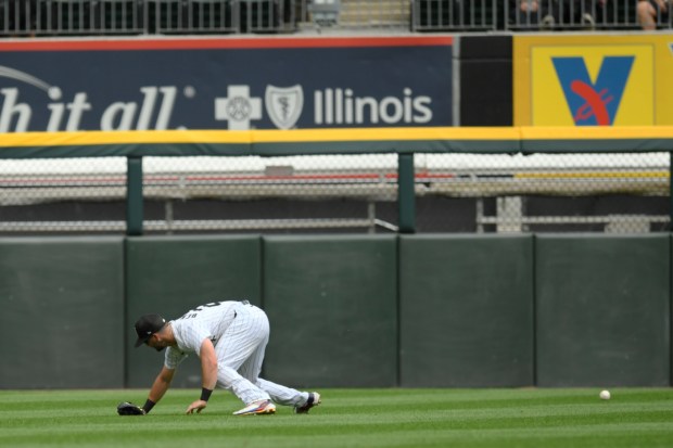 Chicago White Sox left fielder Andrew Benintendi misses a two-RBI triple hit by Pittsburgh Pirates' Nick Gonzales during the seventh inning of a baseball game, Sunday, July 14, 2024, in Chicago. (AP Photo/Paul Beaty)