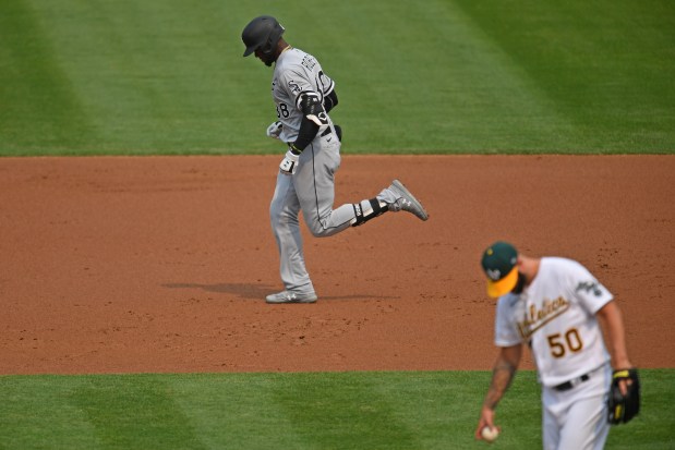 White Sox center fielder Luis Robert rounds the bases after hitting a solo home run against Athletics starter Mike Fiers in the second inning of Game 3 of an American League wild-card series on Oct. 1, 2020, at the Oakland Coliseum in Oakland, Calif. (Jose Carlos Fajardo/Bay Area News Group)