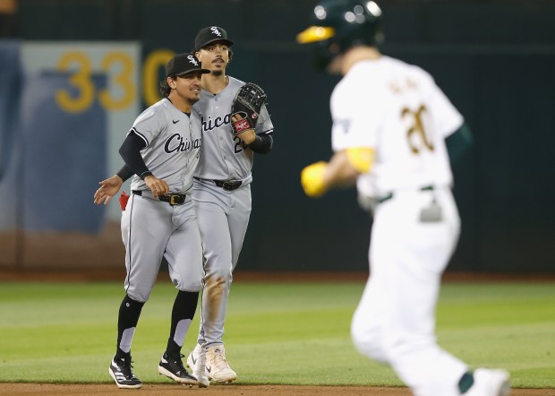 White Sox shortstop Nicky Lopez (8) and third baseman Miguel Vargas celebrate a 5-1 win against the Athletics on Aug. 6, 2024, in Oakland, Calif. (Lachlan Cunningham/Getty Images)