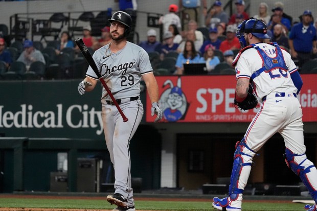 Chicago White Sox's Paul DeJong (29) heads to the dugout after striking out during a baseball game against the Texas Rangers in Arlington, Texas, Wednesday, July 24, 2024. (AP Photo/LM Otero)